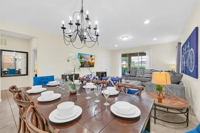 a table room with furniture and a chandelier