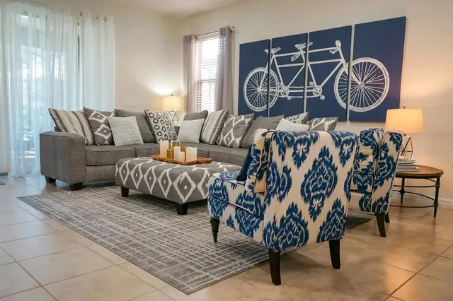 a theatre with furniture and wall paintings