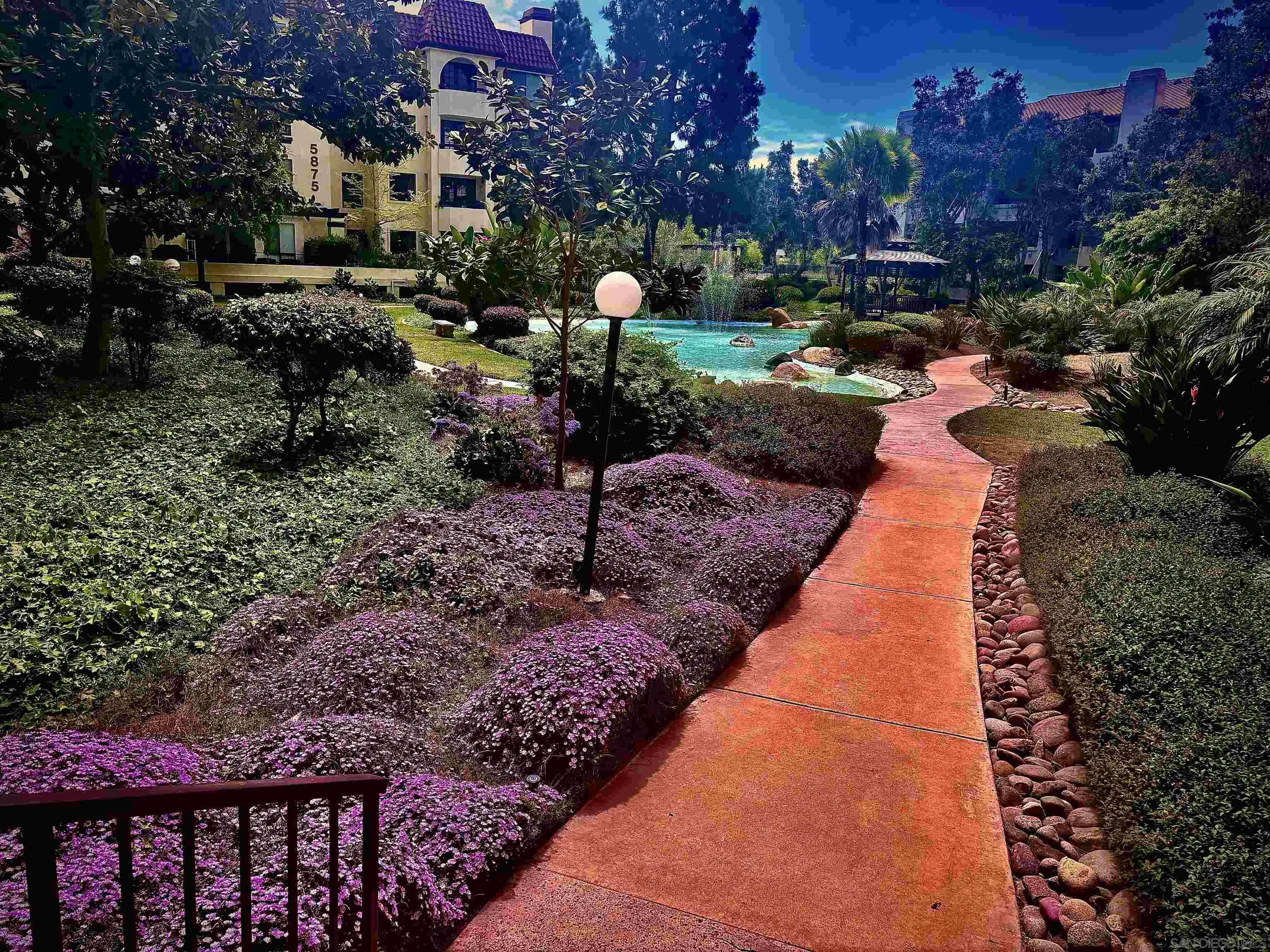 5845 Friars Road, Unit 1201 San Diego, CA 92110 - Photo 23 of 24 a backyard of a house with lots of green space