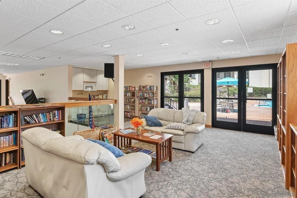 5845 Friars Road, Unit 1201 San Diego, CA 92110 - Photo 24 of 24 a living room with furniture and a flat screen tv