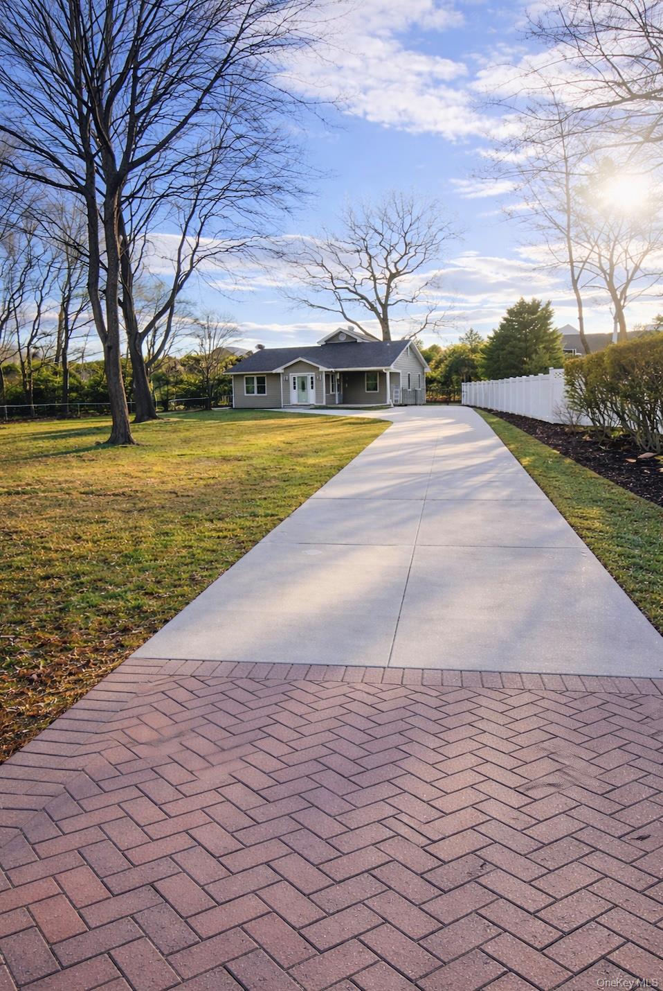 56 Wylde Road Mount Sinai, NY 11766 - Photo 2 of 6 Front View Driveway & House