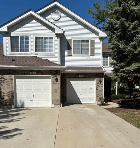 a front view of a house with a garage