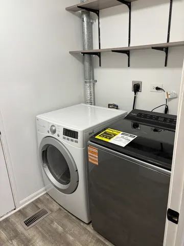 a utility room with dryer and washer