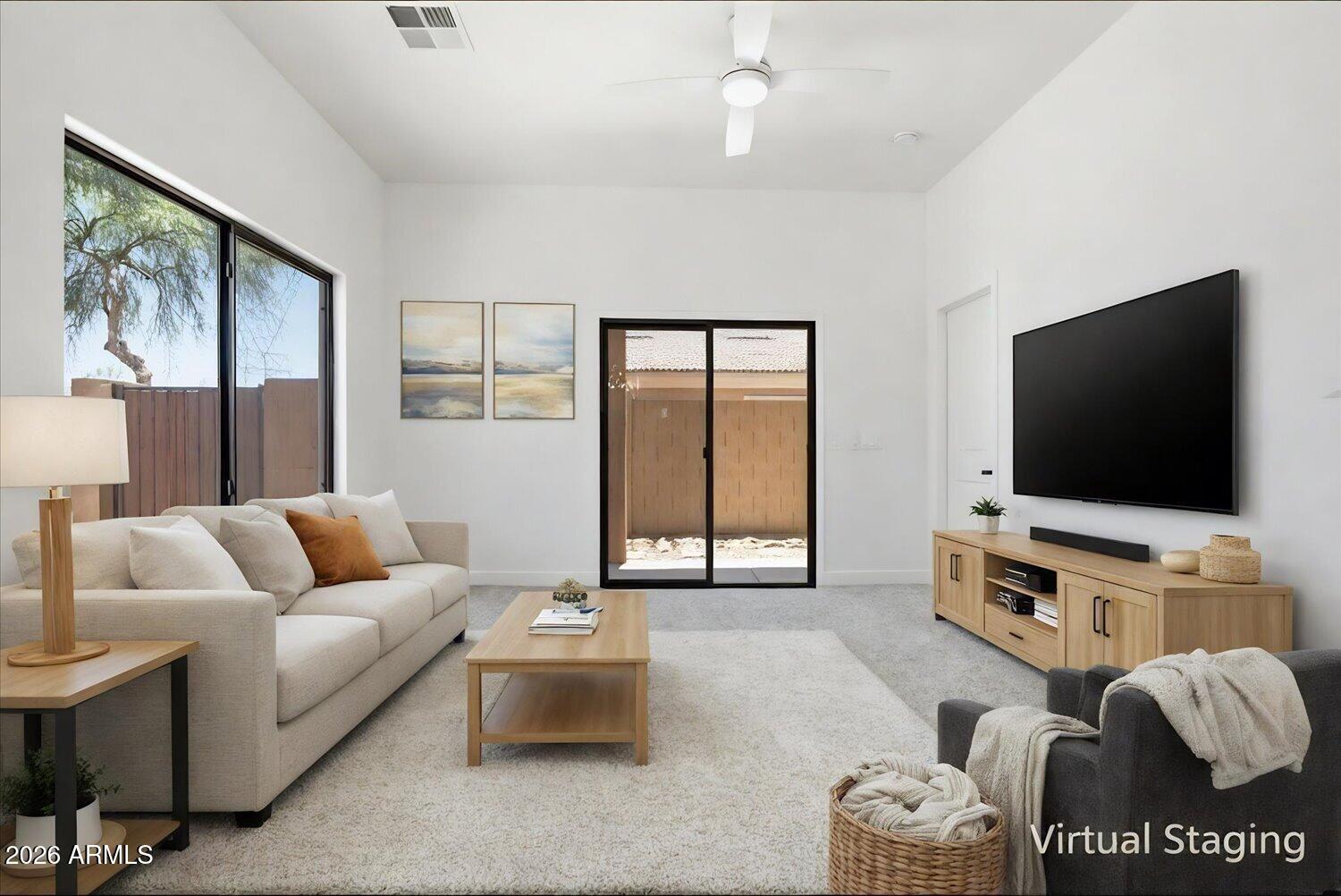 2565 South Signal Butte Road, Unit 23 Mesa, AZ 85209 - Photo 6 of 29 a living room with furniture and a flat screen tv