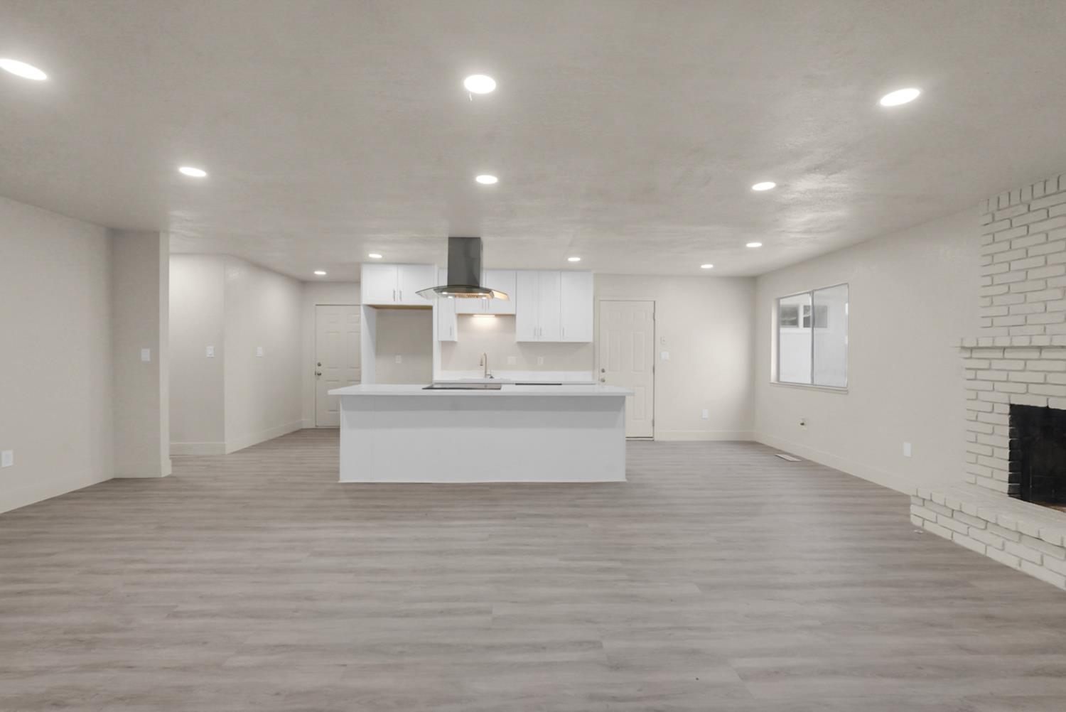 2832 Fowler Road Ceres, CA 95307 - Photo 2 of 28 a view of kitchen with kitchen island a sink wooden floor and a refrigerator