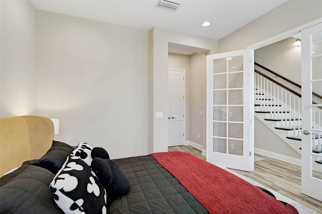 1616 Resolute Street Celebration, FL 34747 - Photo 31 of 46 a bedroom with a bed and a window