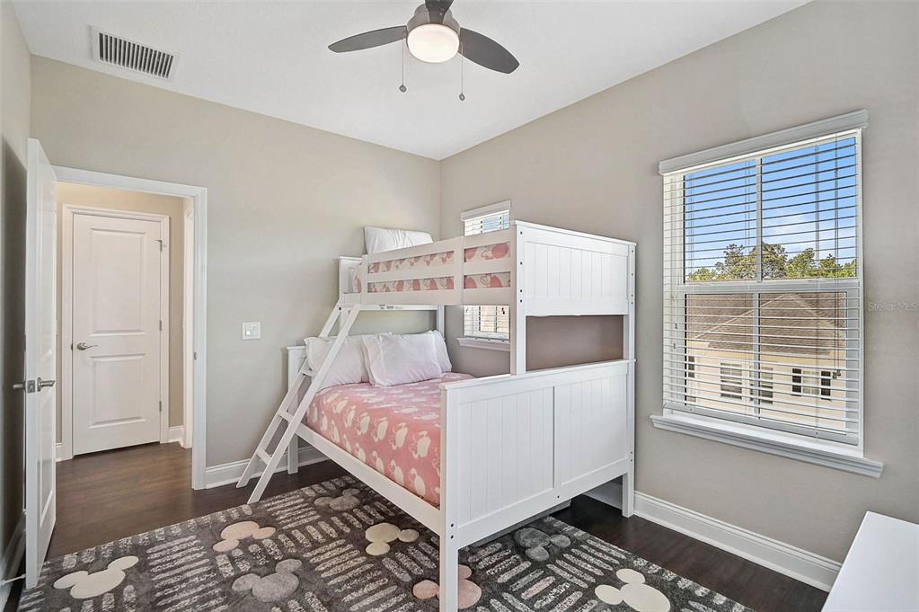 1616 Resolute Street Celebration, FL 34747 - Photo 34 of 46 a bedroom with a bed and a window