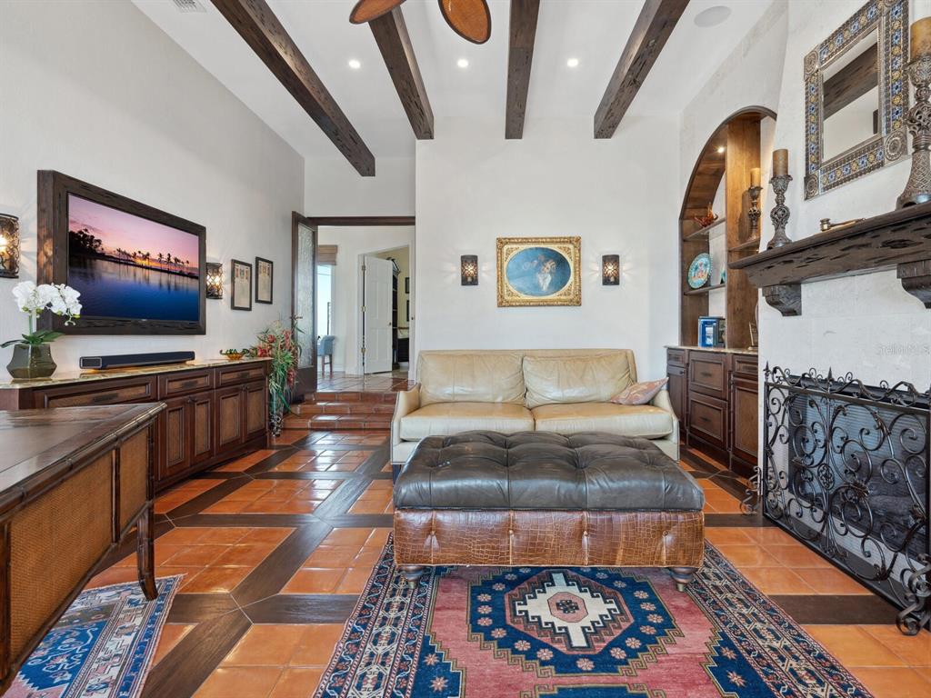 2110 Casey Key Road Nokomis, FL 34275 - Photo 15 of 75 a living room with furniture and a flat screen tv