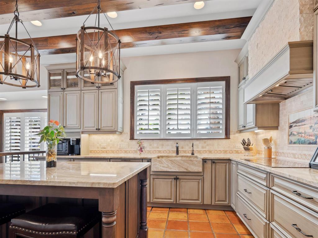 2110 Casey Key Road Nokomis, FL 34275 - Photo 17 of 75 a kitchen with stainless steel appliances granite countertop a sink stove and cabinets