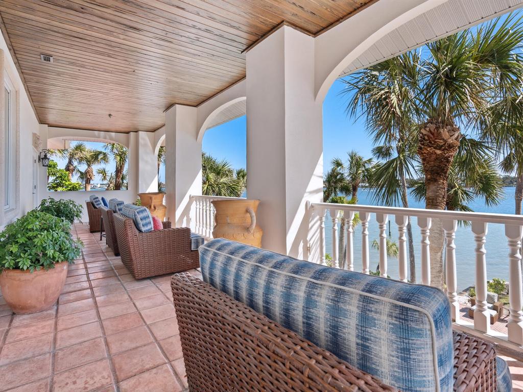 2110 Casey Key Road Nokomis, FL 34275 - Photo 24 of 75 a balcony with furniture and a potted plant