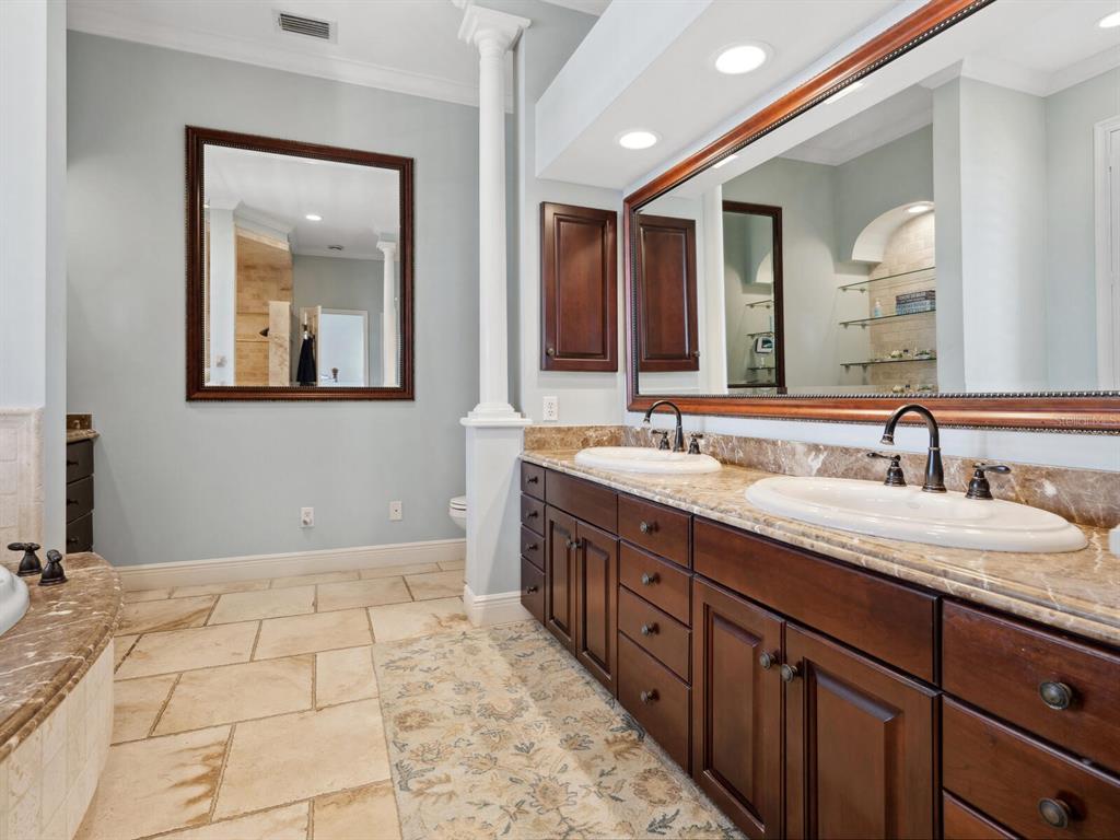 2110 Casey Key Road Nokomis, FL 34275 - Photo 29 of 75 a bathroom with a double vanity sink and a mirror
