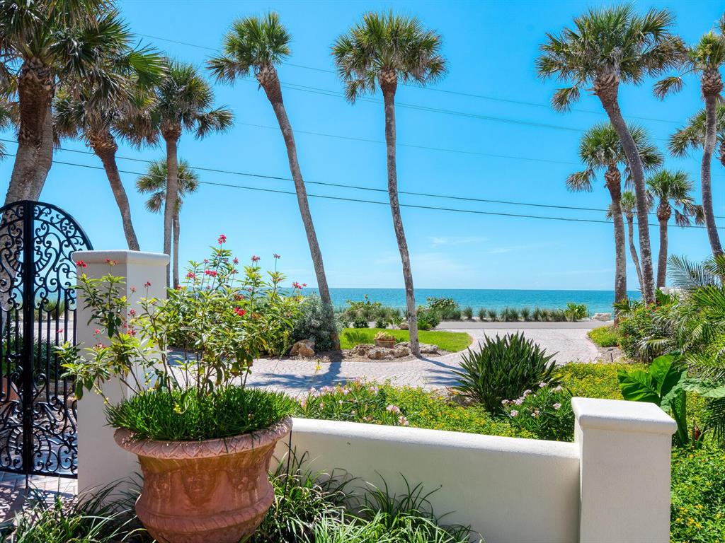 2110 Casey Key Road Nokomis, FL 34275 - Photo 34 of 75 a view of a house with a yard and potted plants