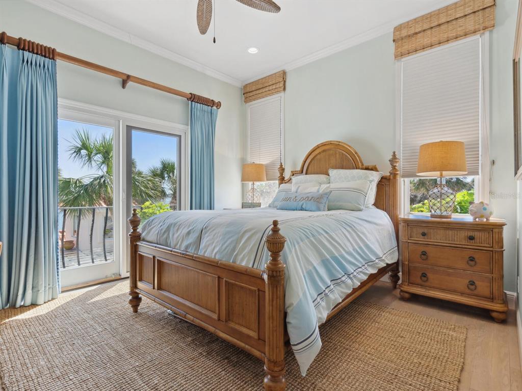 2110 Casey Key Road Nokomis, FL 34275 - Photo 37 of 75 a bedroom with a bed and a window