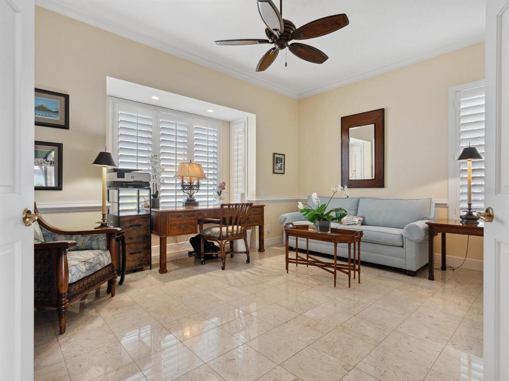 2110 Casey Key Road Nokomis, FL 34275 - Photo 38 of 75 a living room with furniture and a window