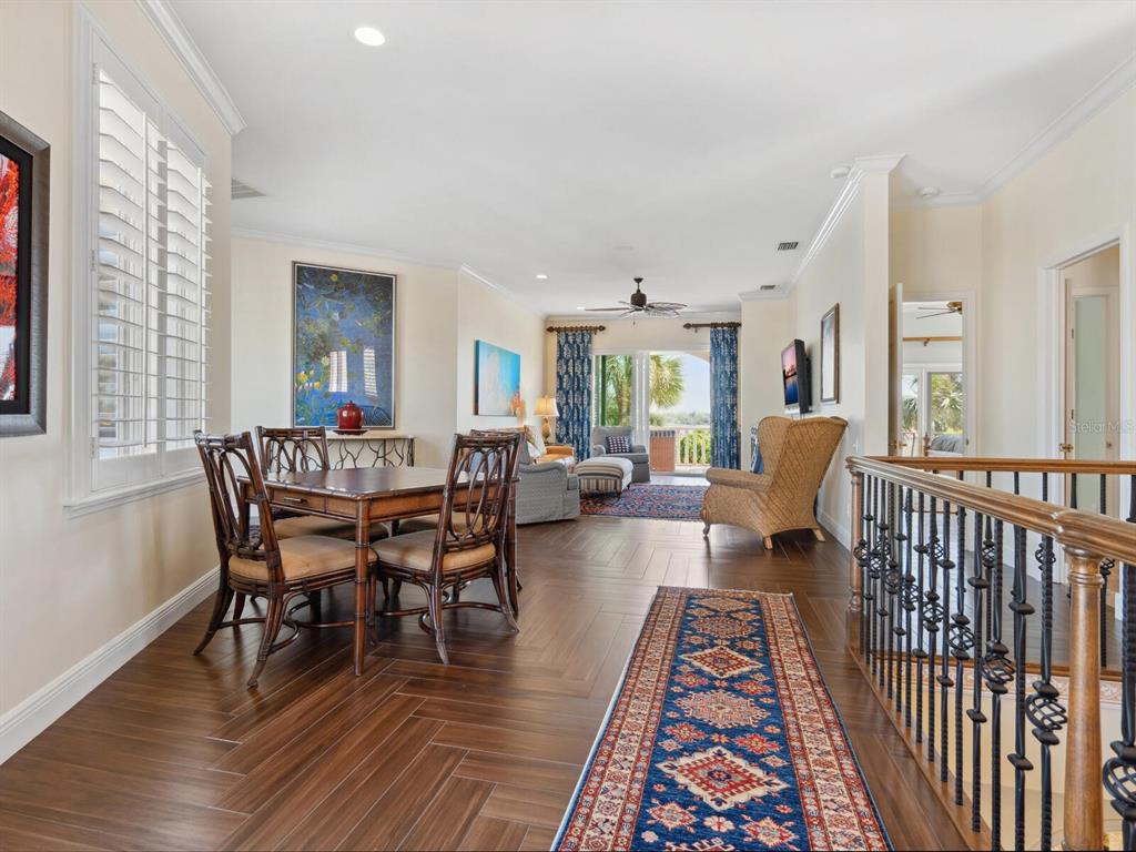 2110 Casey Key Road Nokomis, FL 34275 - Photo 40 of 75 a living room with furniture wooden floor and a rug