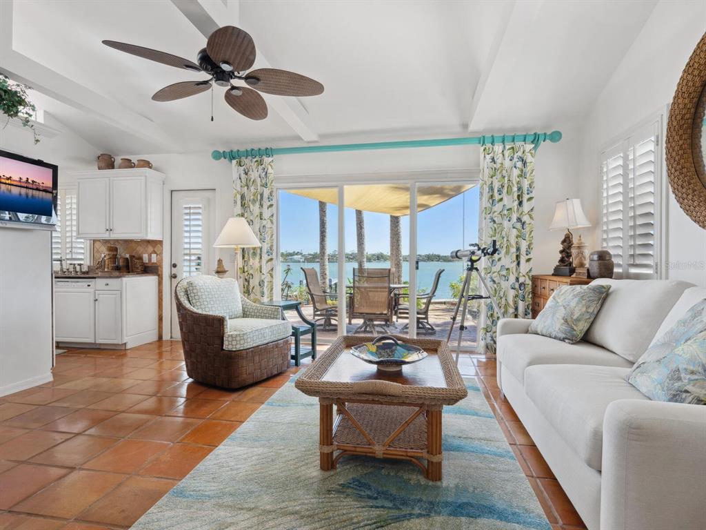 2110 Casey Key Road Nokomis, FL 34275 - Photo 47 of 75 a living room with furniture kitchen view and a large window