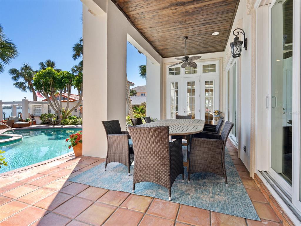 2110 Casey Key Road Nokomis, FL 34275 - Photo 56 of 75 a view of a patio with a table and chairs in patio