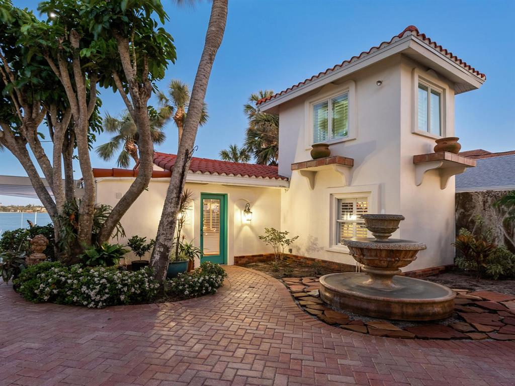 2110 Casey Key Road Nokomis, FL 34275 - Photo 60 of 75 a front view of a house with garden