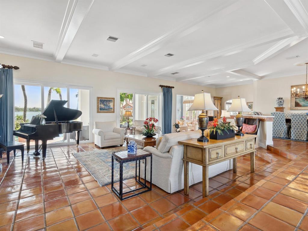 2110 Casey Key Road Nokomis, FL 34275 - Photo 6 of 75 a living room with fireplace furniture and a table