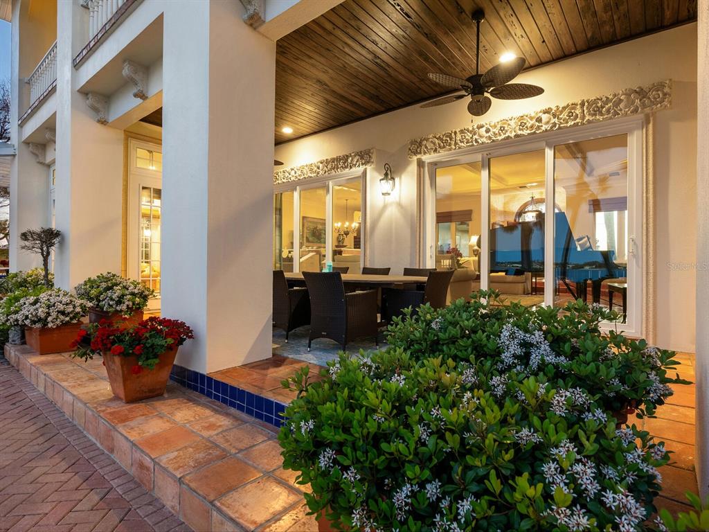 2110 Casey Key Road Nokomis, FL 34275 - Photo 61 of 75 a view of a porch with chairs and potted plants