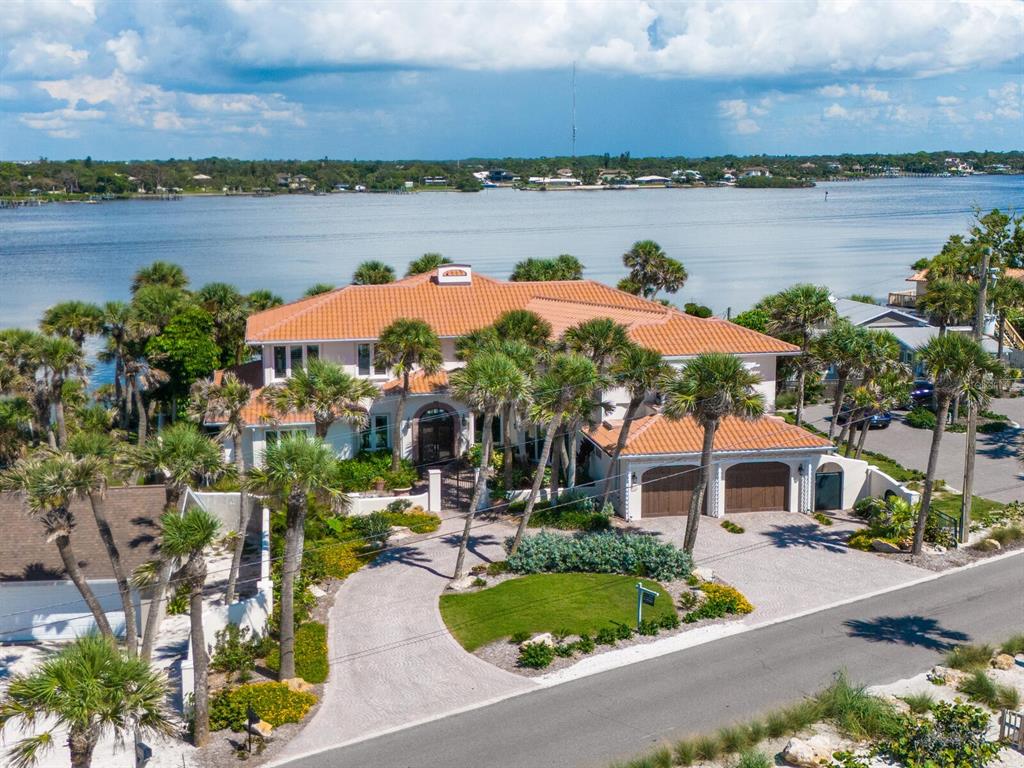 2110 Casey Key Road Nokomis, FL 34275 - Photo 71 of 75 a front view of a house with a lake view and mountain view