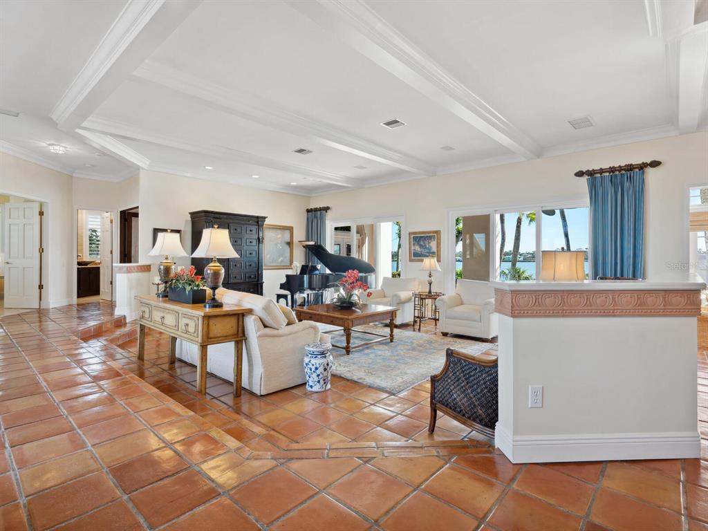 2110 Casey Key Road Nokomis, FL 34275 - Photo 8 of 75 a living room with couches and a dining table with kitchen view