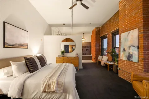 a bedroom with bed and window