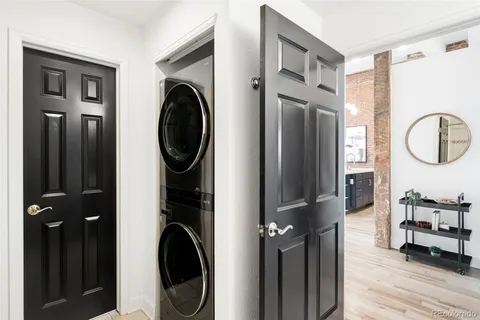 a view of a hallway with washer and dryer