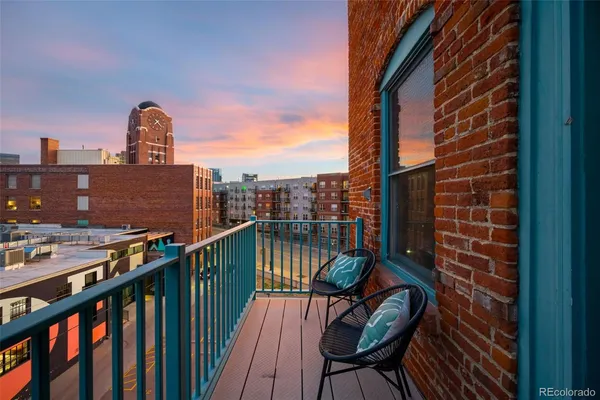 a view of balcony with furniture