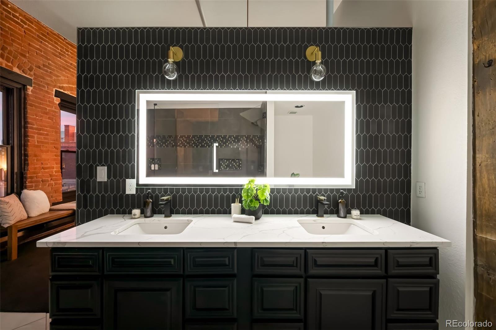 2560 Blake Street, Unit 402 Denver, CO 80205 - Photo 5 of 50 a bathroom with a sink and a mirror