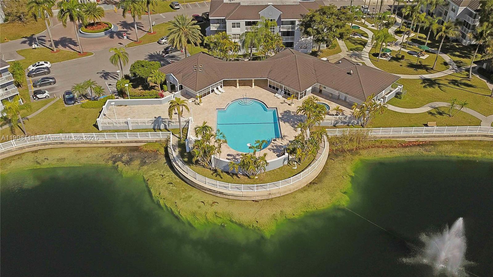 8590 Southwest 212th Street, Unit 211 Cutler Bay, FL 33189 - Photo 2 of 22 an aerial view of a swimming pool