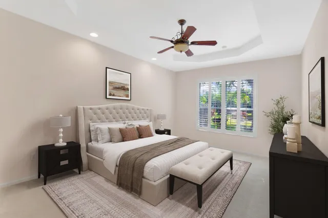 a bedroom with a large bed and a window