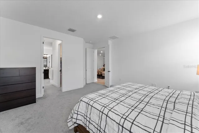 a bedroom with a bed and a cabinets