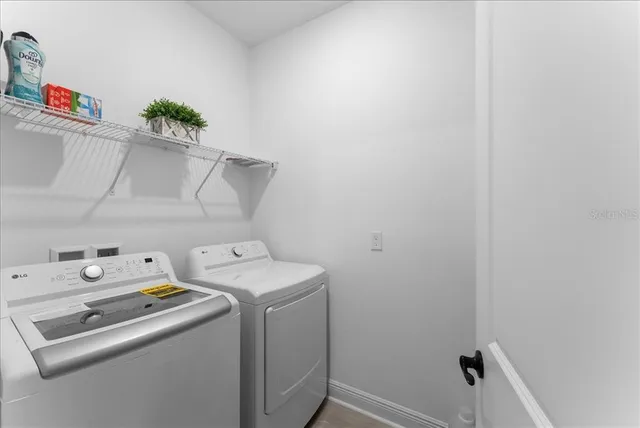 a utility room with dryer and washer