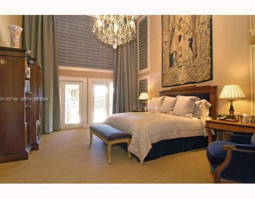 4511 Lake Road Miami, FL 33137 - Photo 5 of 14 a bedroom with a bed and a painting on the wall