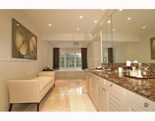 4511 Lake Road Miami, FL 33137 - Photo 6 of 14 a bathroom with a granite countertop sink mirror and bathtub