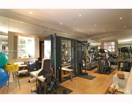 4511 Lake Road Miami, FL 33137 - Photo 7 of 14 a living room with lots of gym equipment