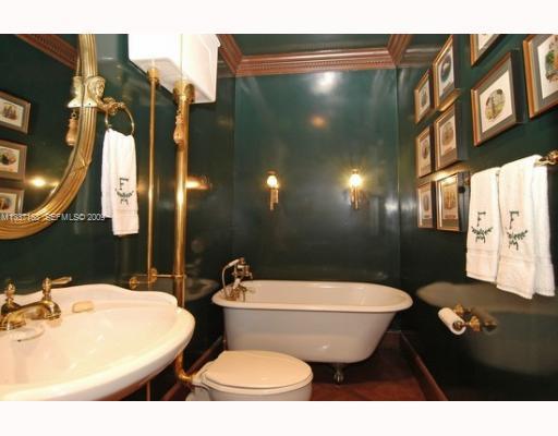 4511 Lake Road Miami, FL 33137 - Photo 9 of 14 a bathroom with a sink and mirror