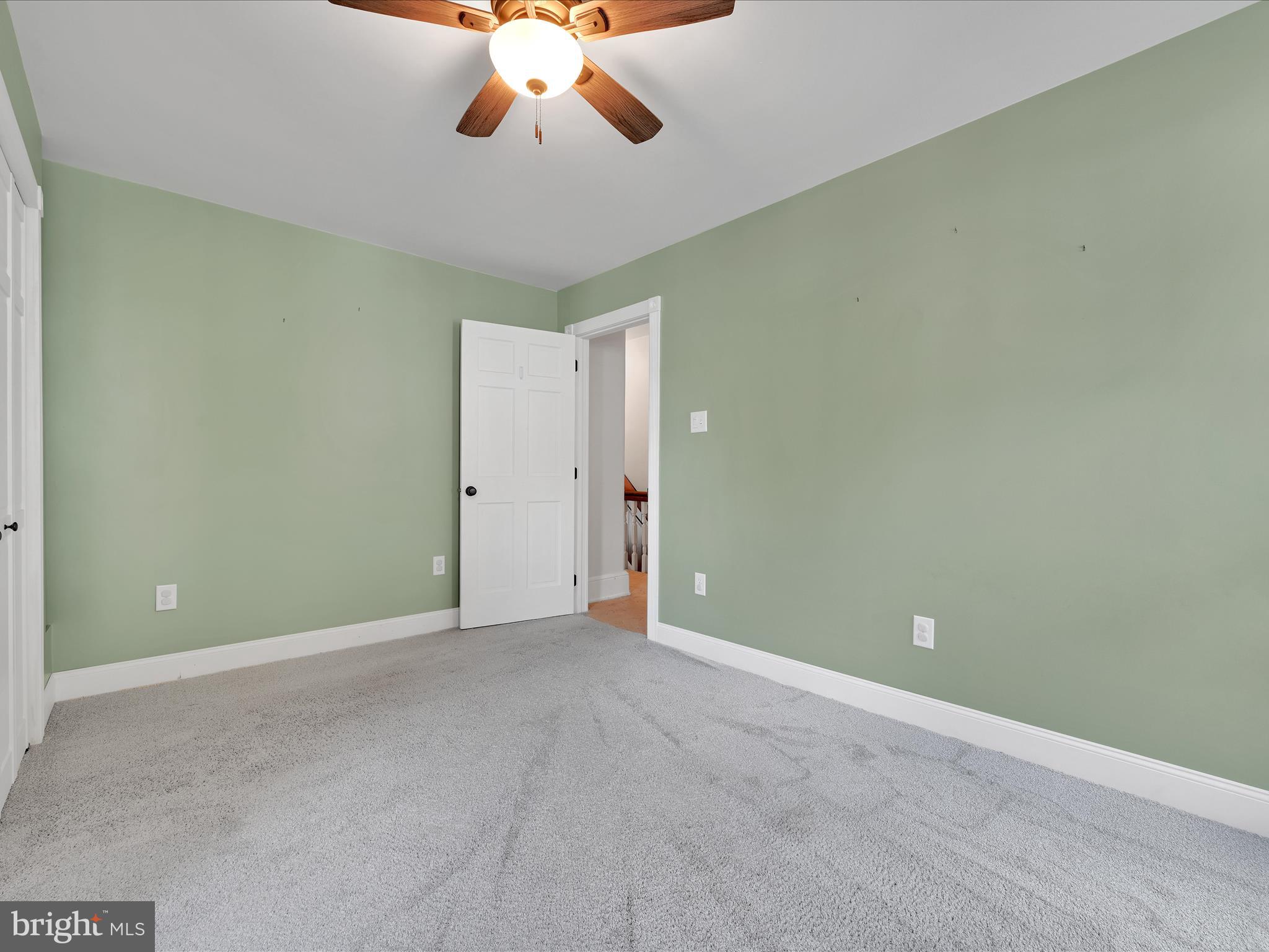 1425 Friedensburg Road Reading, PA 19606 - Photo 18 of 28 an empty room with a chandelier fan and wooden floor