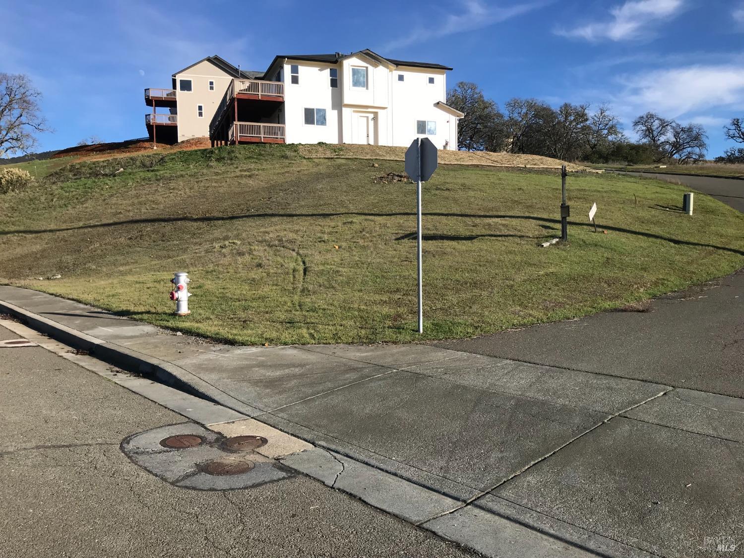 a view of a street with a building in the background