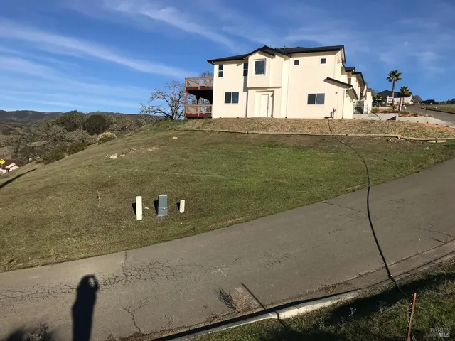 a view of a pool with a yard