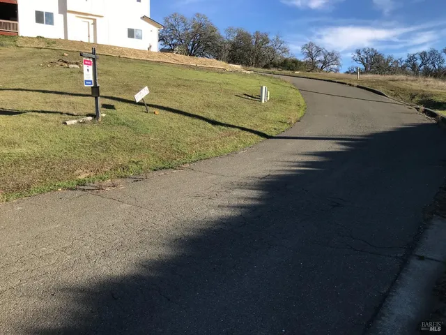 a view of a big yard with an buildings