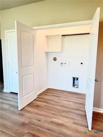 a bedroom with a bed and a shower