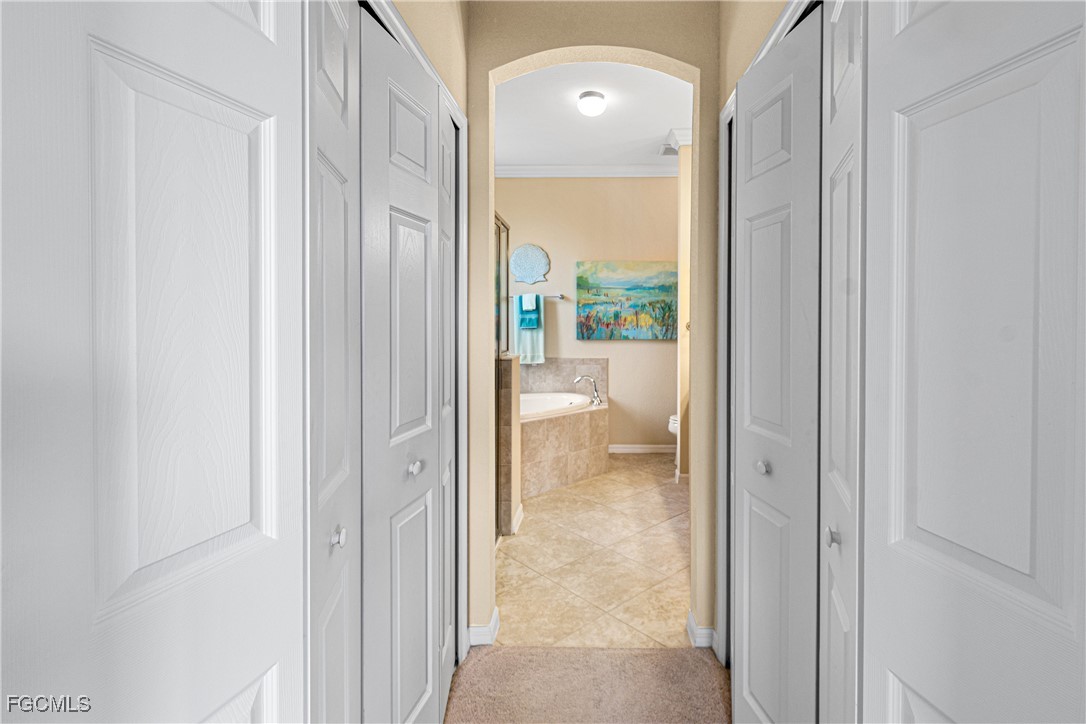 9138 Water Tupelo Road Fort Myers, FL 33912 - Photo 15 of 28 a view of a bathroom from a hallway