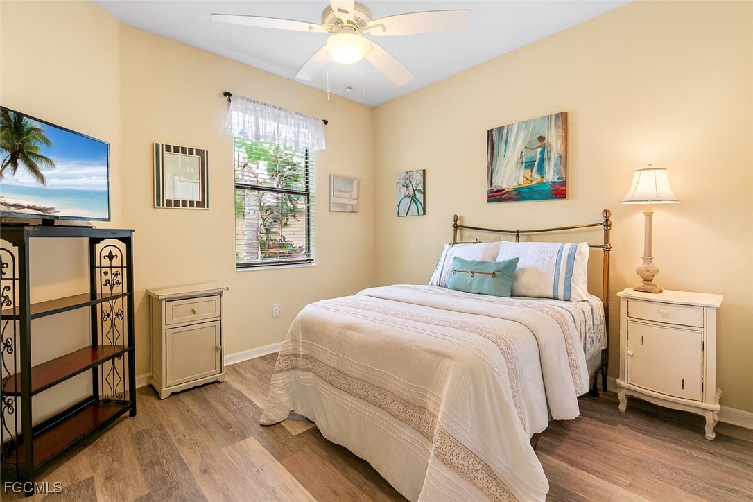 9138 Water Tupelo Road Fort Myers, FL 33912 - Photo 18 of 28 a bedroom with a bed and a window