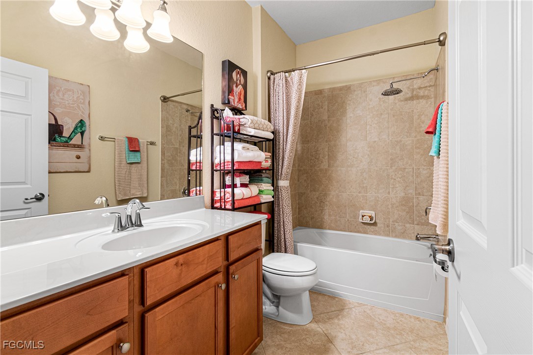 9138 Water Tupelo Road Fort Myers, FL 33912 - Photo 19 of 28 a bathroom with a sink a toilet and shower
