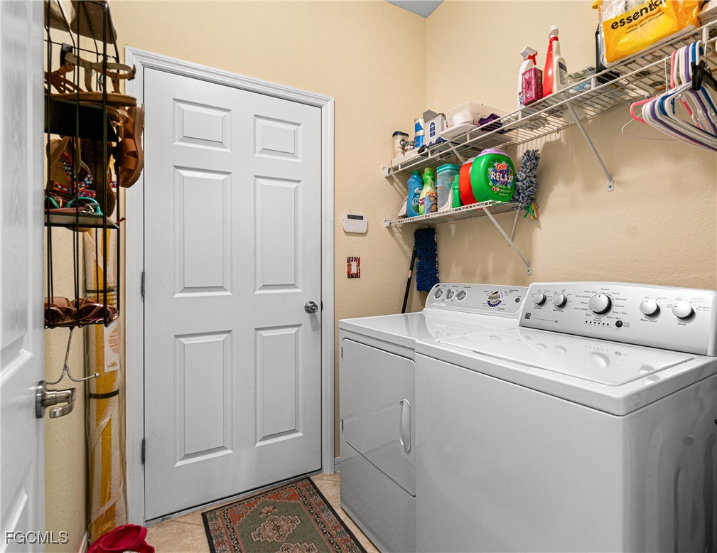 9138 Water Tupelo Road Fort Myers, FL 33912 - Photo 20 of 28 a utility room with dryer and washer