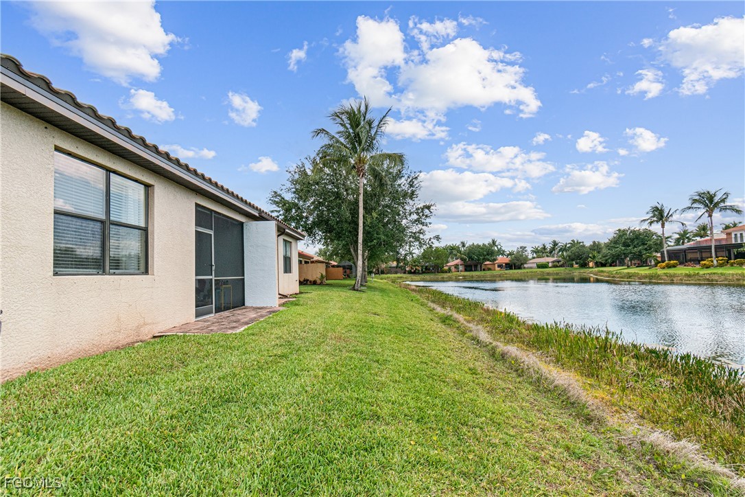 9138 Water Tupelo Road Fort Myers, FL 33912 - Photo 22 of 28 a view of a house with pool and lake view