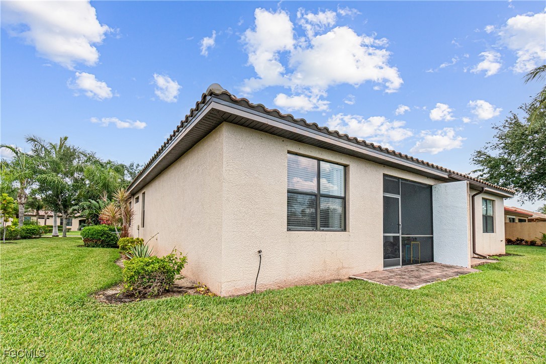 9138 Water Tupelo Road Fort Myers, FL 33912 - Photo 23 of 28 a view of an house with backyard space and garden