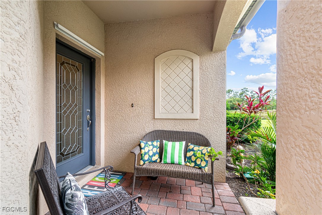 9138 Water Tupelo Road Fort Myers, FL 33912 - Photo 3 of 28 a front view of a house with outdoor seating